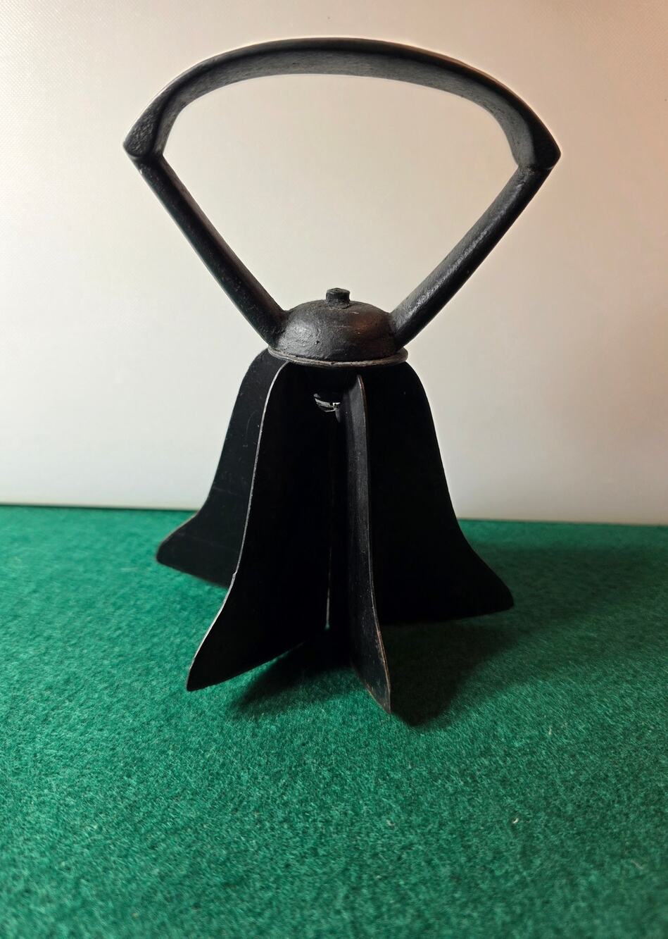 Vintage handheld metal food chopper bell-shaped cast iron handle